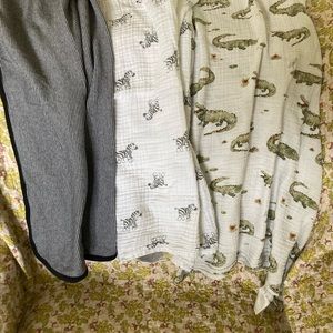 3 baby blankets. Striped, zebra, and alligator, used all different brands!